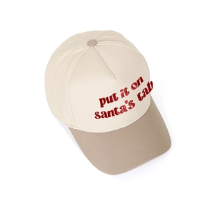 Macro detail of Put It on Santa's Tab red embroidery on two-tone canvas baseball cap