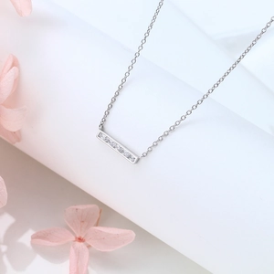 Detail view of silver 925 rectangle pendant with white cubic zirconia on chain