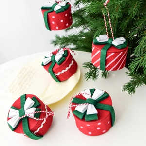 Mini felt Christmas gift box ornaments in red and green for festive tree decoration