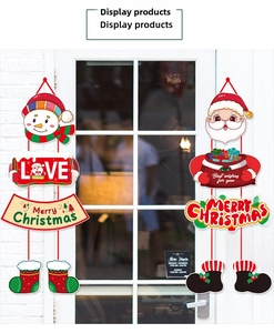 Detail der Weihnachtsbanner mit Weihnachtsmann und Schneemann auf einer weißen Glastür