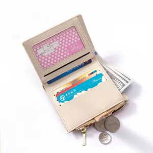 Short beige minimalist leather wallet with multiple card slots and gold zipper closure