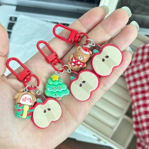 Cute Christmas apple keychains with bear and gingerbread charms for festive gifting