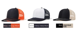 Detailed view of three trucker hats in navy, white and black with breathable mesh backs