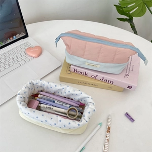 Detail of quilted pencil case showing large capacity and contrasting color design