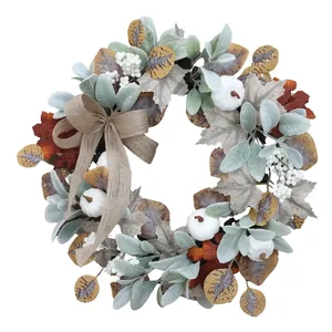 Autumn wreath with sunflowers, white pumpkins, maple leaves and burlap bow on white background