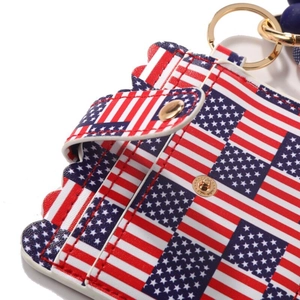 Detail of American flag pattern card holder with gold ring and blue beaded lanyard