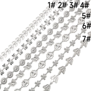 Detailed view of silver stainless steel craft chains with butterfly and mushroom charms