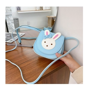 Close-up of a blue PU leather kids crossbody bag with a cute white rabbit face design