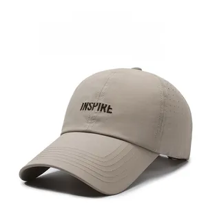 Detail of khaki breathable baseball cap with laser-cut holes and INSPIRE embroidery