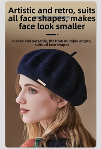 Detail of navy wool beret featuring a signature gold metal logo tag on the side