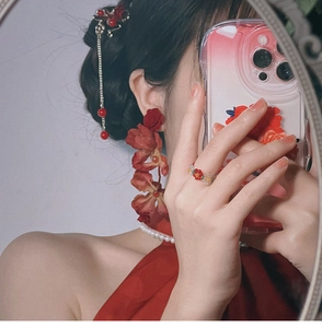 Detail of red rose earrings with long bead tassels and matching vintage floral ring