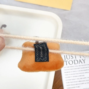 Cute orange plush rice ball hair tie with hand made tag for girls hair styling