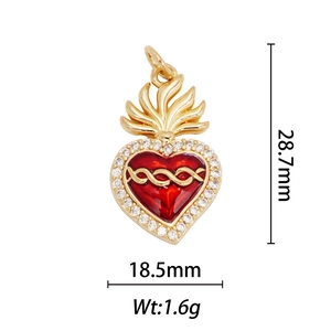 Detailed view of a 28.7mm gold heart pendant with red enamel and white zircon stones