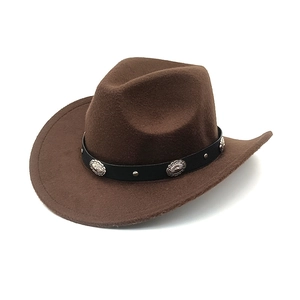 Detail of classic brown western cowboy felt hat with vintage studded leather band
