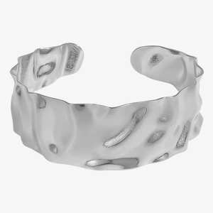 Detailed view of silver open cuff bracelet with irregular hammered texture and wavy edges