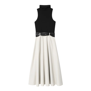 Elegant sleeveless high-neck dress with black and white color blocking and waist belt