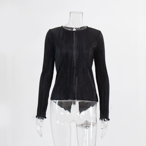 Close-up of pleated black slim-fit shirt with vertical texture and flared sleeve detail