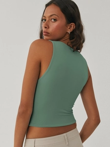 Close-up of ribbed knit texture and stitching on dark green slim fit tank top