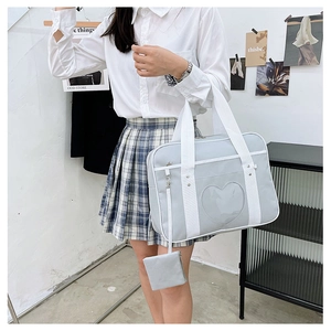 Grey JK uniform ita bag with heart window and small matching wallet on strap