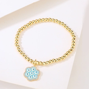 18K gold plated bead bracelet with blue enamel flower charm and evil eye zircon inlay