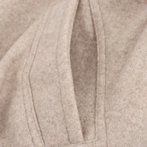 Beige soft wool bomber jacket for women featuring detailed stitching on side pockets