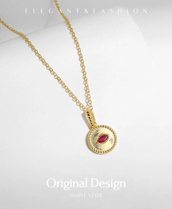 Detail of s925 silver vintage necklace with red crystal on elegant white background