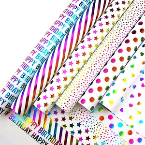 Laser gift wrapping paper roll set with holographic gold polka dots and birthday patterns