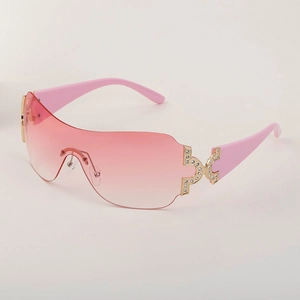 Y2K frameless wrap-around sunglasses with pink gradient lenses and rhinestone accents