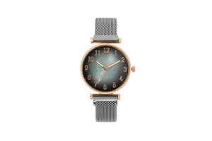 Close-up of rose gold watch with floral dial and grey magnetic mesh metal strap