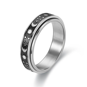 Rotating stainless steel spinner ring with celestial sun moon star pattern on black band