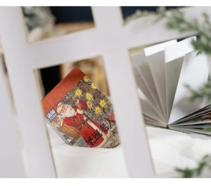 Detail of Christmas washi sticker book featuring vintage Santa Claus and gold foil accents