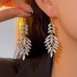 Luxurious gold leaf tassel drop earrings with sparkling marquise crystals for women