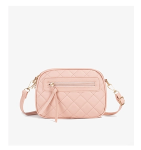 Pink quilted leather crossbody bag featuring dual tassels and polished gold-tone metal hardware