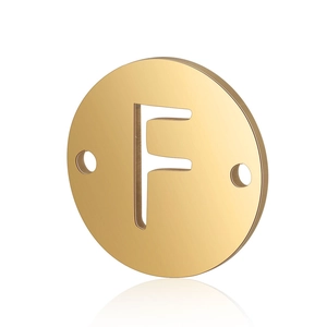 Close-up of golden stainless steel round pendant with letter F and dual side holes