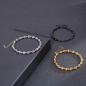 Three mixed color stainless steel coffee bean bracelets in silver, gold, and black finishes