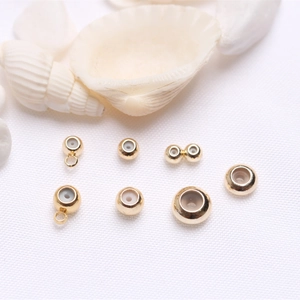 Detail of 14k gold-filled silicone slide beads for adjustable necklace and bracelet making