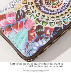 Detail of bohemian ethnic print wallet showing high density fabric and durable metal zipper