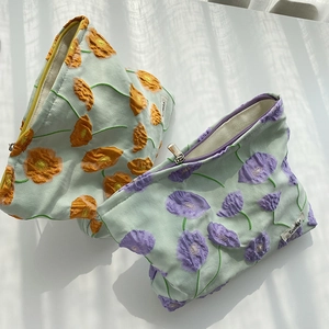 Calla lily floral makeup bags with 3D embossed fabric and secure silver metal zipper