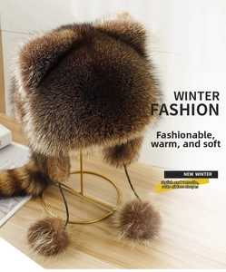 Detail showing the plush faux fur texture and soft pom-poms of the raccoon ear hat