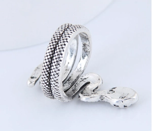 Detailed close-up showing the vintage scale texture on the silver snake ring