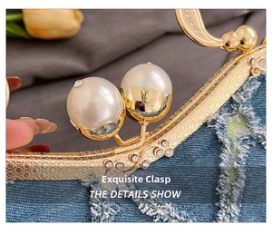 Detailed close-up of blue denim shell bag with vintage gold floral frame and pearl clasp