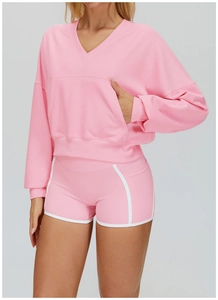 Pink hooded sweatshirt set with kangaroo pocket and high-waisted shorts detail