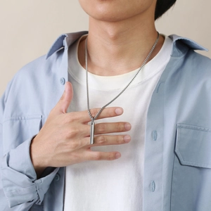 Male model wearing minimalist silver tungsten steel bar pendant with classic link chain