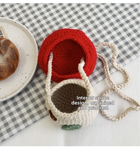 Close-up of handmade crochet mini crossbody bag showing detailed knit texture and inner space