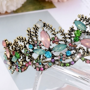 Macro detail of luxury bridal crown featuring vintage bronze alloy and colorful crystals