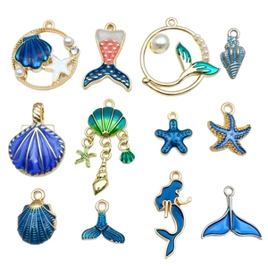 Blue ocean themed enamel charms with starfish, shells and mermaid tails for DIY jewelry