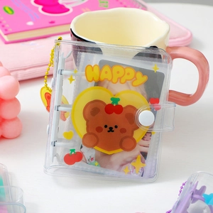 Detail of PVC 3-ring binder photo album with cute cartoon bear and happy text design