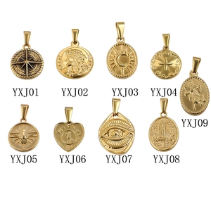 Golden vintage stainless steel pendants featuring divine icons and embossed medallions