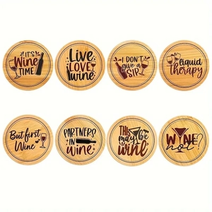 Set of 8 round bamboo coasters with engraved wine-themed quotes and natural wood grain