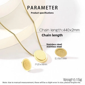 Detailed macro view of matte gold oval pendant and earrings jewelry set on a white stand